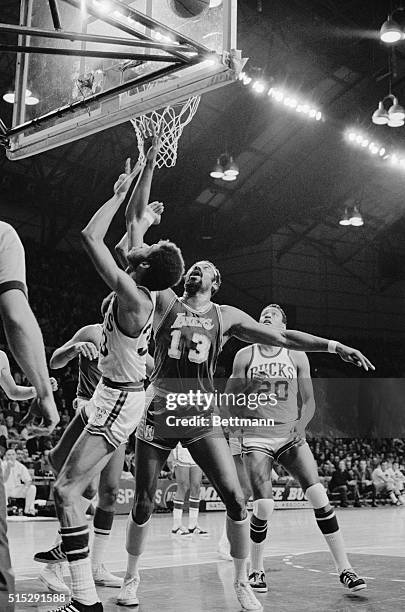 Milwaukee: Lew Alcindor, Milwaukee Bucks sneaked in front of Los Angeles Lakers Wilt Chamberlain for a layup during the Bucks-Lakers game December...