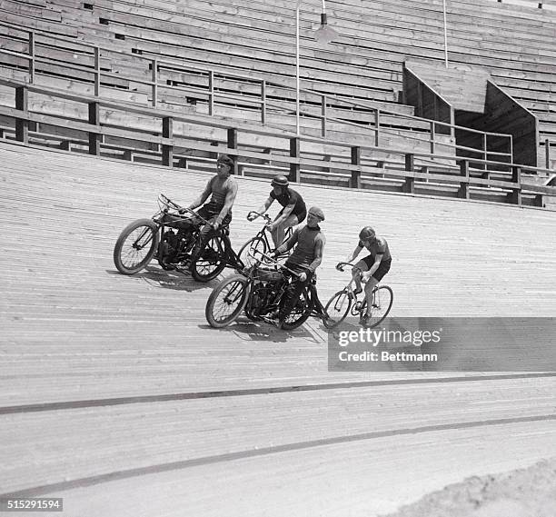 Bike Riders Train at the New York Velodrome. Jackie Clark pacing Eddie Root, and Percy Lawrence pacing Arthur Miller at New York's New Velodrome...