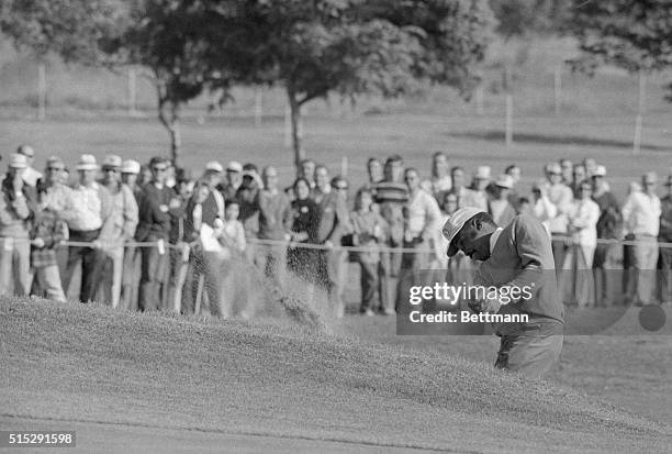 Pete Brown, who won the Andy Williams San Diego Open with a 13-under par 275 in a sudden death playoff with Tony Jacklin, blasts from a sand trap on...