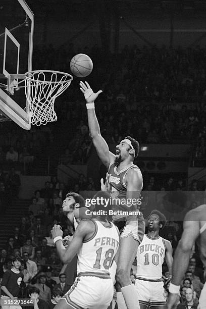 Los Angeles Lakers Wilt Chamberlain looked happy as he scored two points over Milwaukee Bucks Kareem Jabbar and Curtis Perry in the Bucks-Lakers...