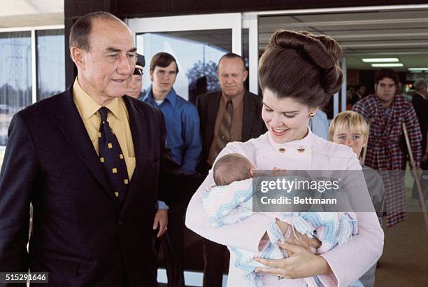 Greenwood, SC: Senator Strom Thurmons , his wife Nancy and baby girl, Nancy Moore Thurmond leave Self Memorial Hospital. They were taking the baby...