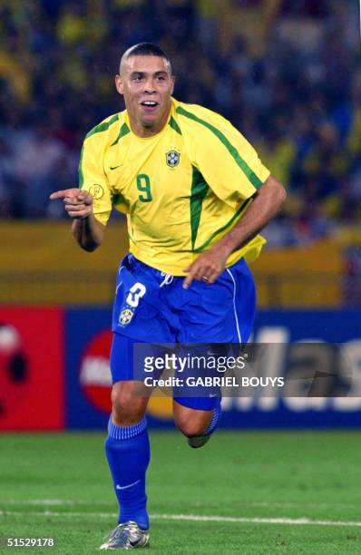 Brazil's forward Ronaldo celebrates after scoring the second goal against Germany during the final match of the FIFA 2002 World Cup Korea Japan at...
