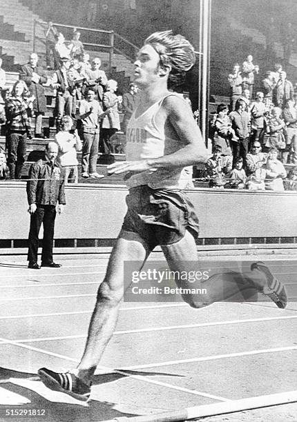 University of Oregon distance star Steve Prefontaine crossing the finish line in the 5000 meter run Saturday, breaking his own American record with a...