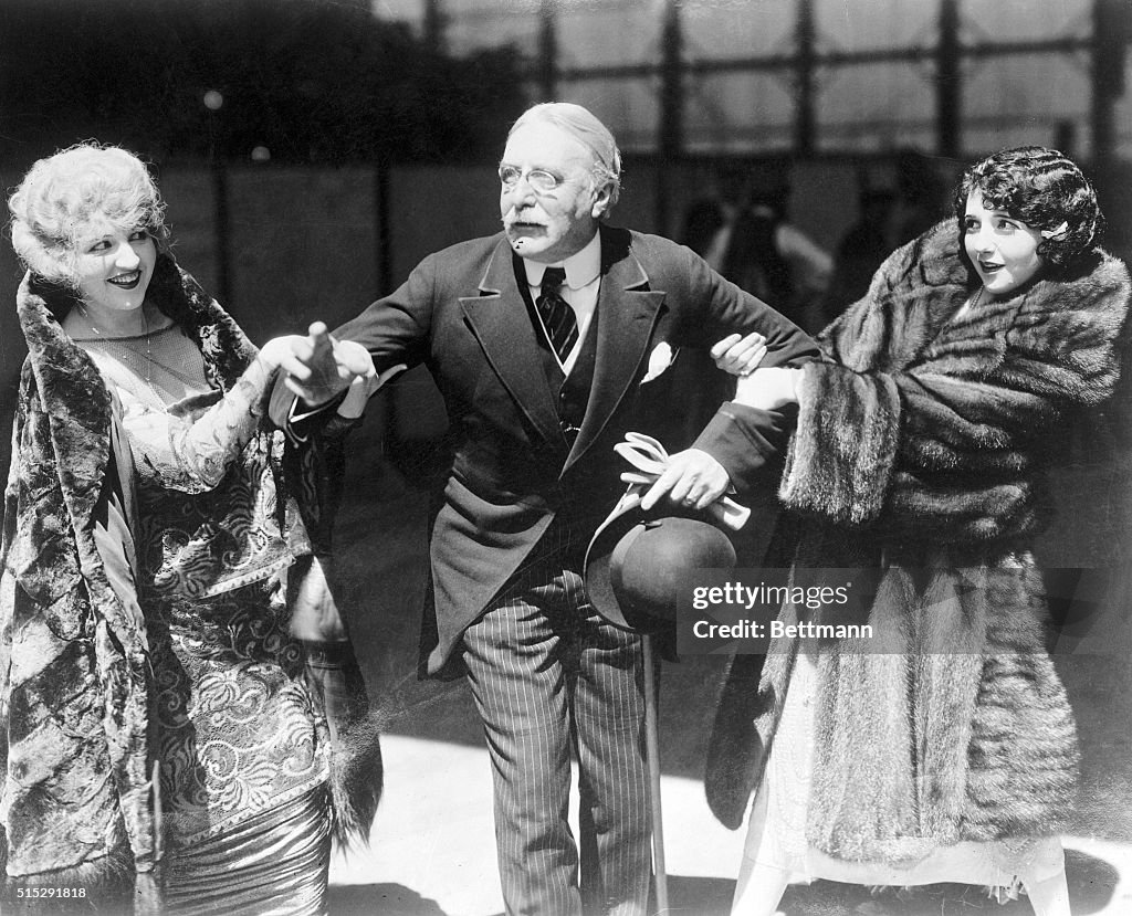 H. Gordon Selfridge Posing with Julia Faye and Bebe Daniels