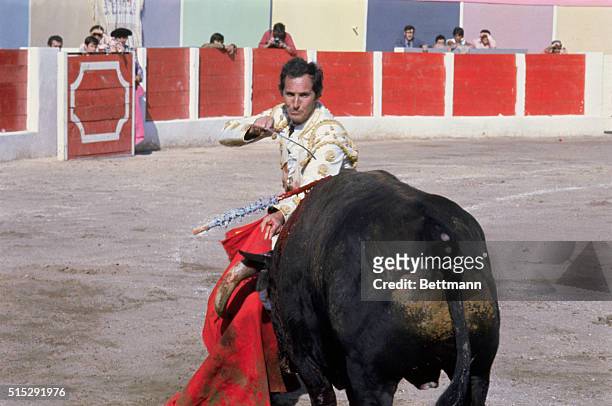 Las Palmas, Canary Islands: Matador Luis Miguel Dominguin prepares for the "moment of truth" as he faces el toro during corrida at Plaza de Toros....
