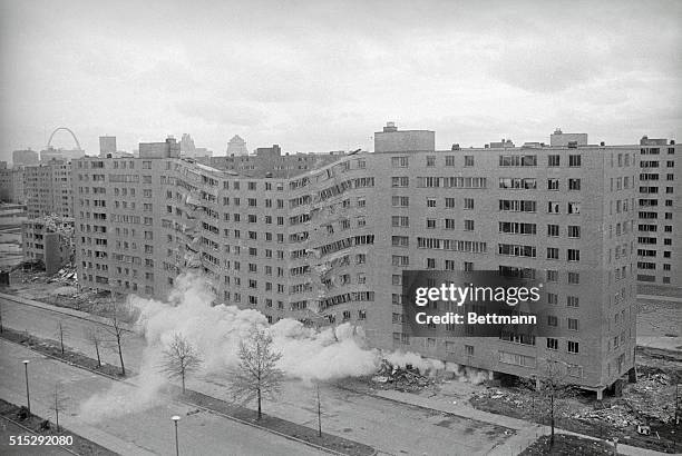 Second story building in the massive Pruitt-Igoe public housing complex is demolished by dynamite here. Dynamite charges placed under each pillar of...