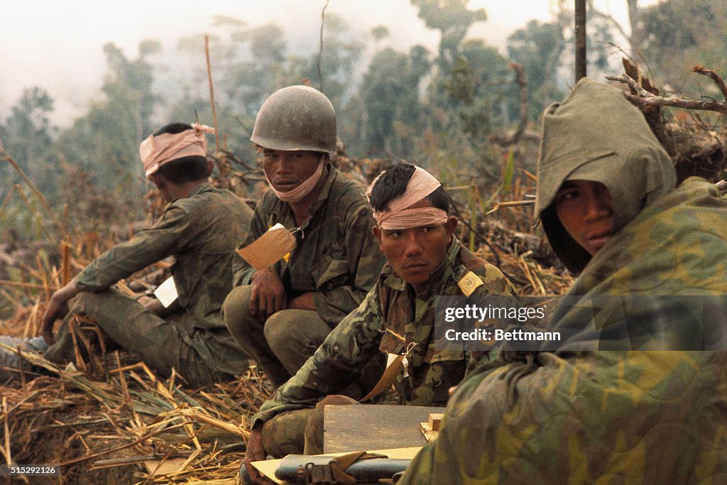 Soldiers Waiting on Ground for Help