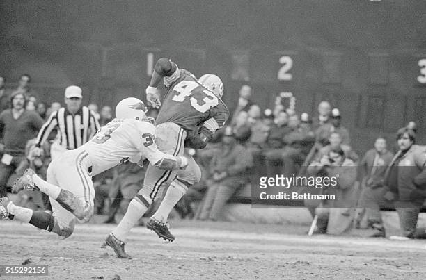 Redskin running back Larry Brown drags Steve Breece of the Eagles across the goal line as Brown scores in the 2nd period of their game 13/13. Brown...