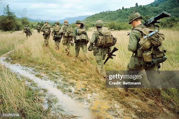 Operation Thayer II...Walking the high-ground that outlines rice paddies, members of the 1/12th, 1st Brigade, 1st Cavalry go through the paces of a...