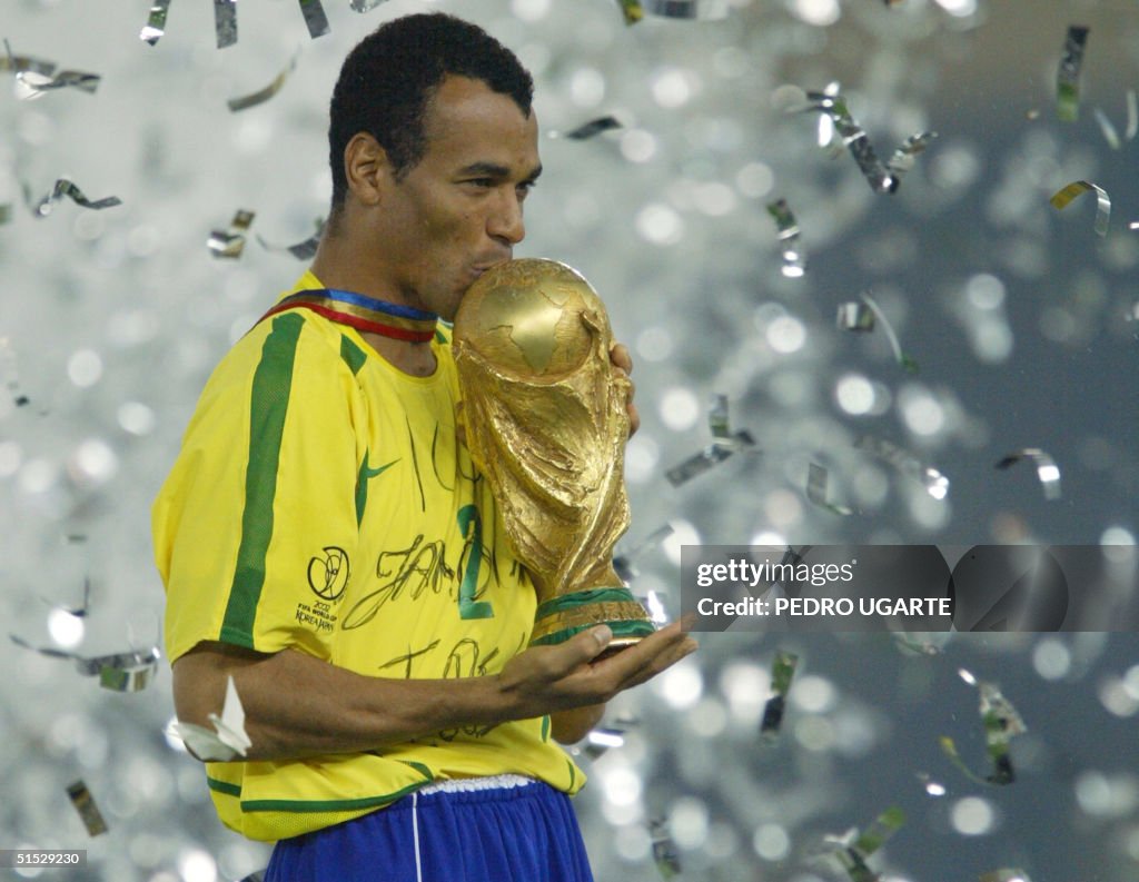 Brazil's team captain and defender Cafu kisses the