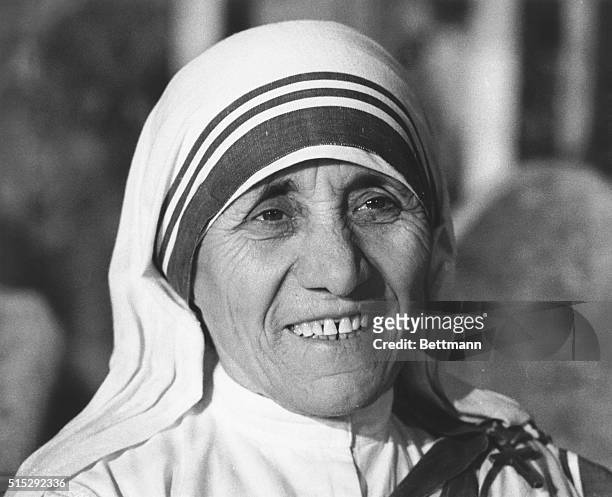 Mother Teresa who came from India and knelt before Pope Paul in the Vatican's Clementine Hall to receive the first Pope John XXIII peace prize, a...