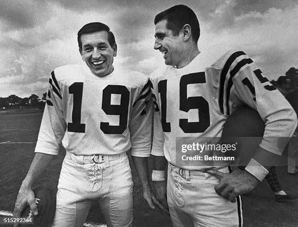 Baltimore quarterbacks John Unitas and Earl Morall share a light moment at their practice field, where the Colts are preparing for their 1/17 Super...