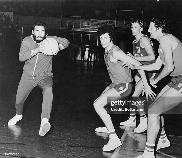 Cuban Premier Fidel Castro has the ball during basketball game. Castro is on a week-long official visit to Poland as part of a two-month tour of...
