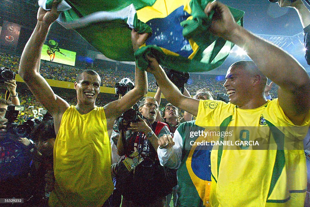 Brazil's forward Ronaldo (R) and midfielder Rivald