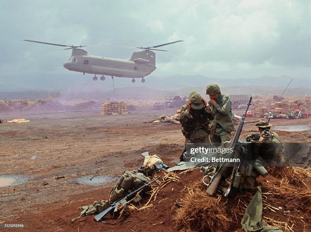 Army Helicopter Lowering Supplies at Vietnam Air Field