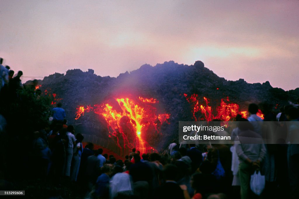 People Watching Mount Etna Erupt