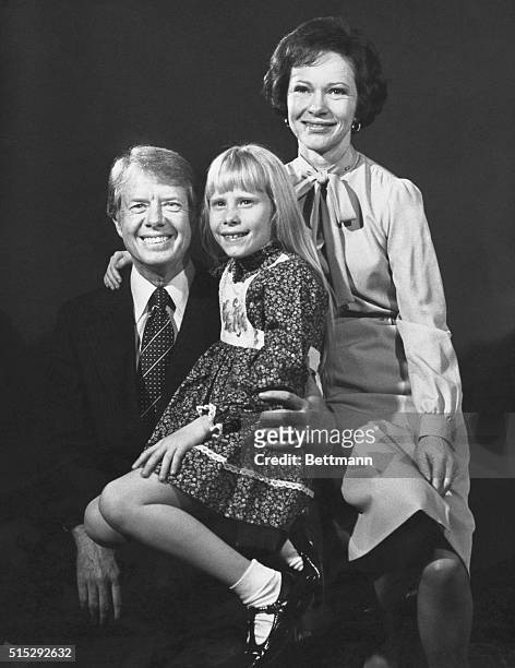 Plains, GA- President-elect, Jimmy Carter, his wife, Rosalynn, and daughter, Amy, pose for a family portrait.
