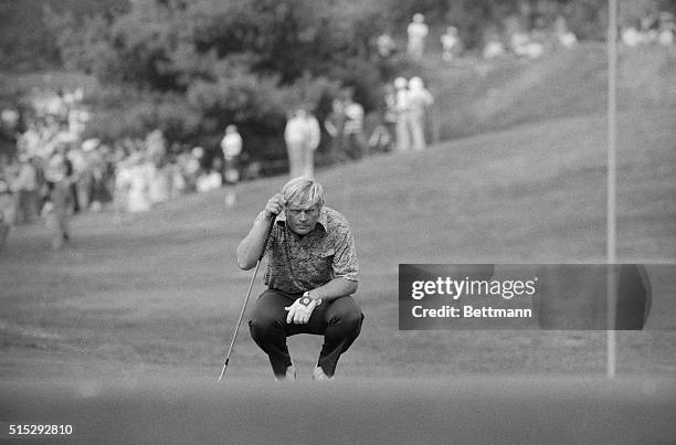 Jack Nicklaus looks serious as he examines the possibilities as he prepares to putt on the 16th hole during the third round of the $250,000...