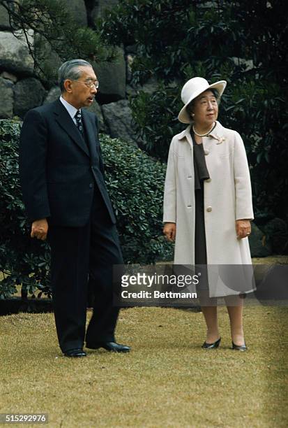 Tokyo, Japan: Emperor Hirohito and Empress Nagako pose in the Imperial Palace gardens.