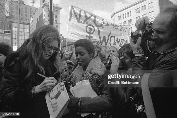 Rep. Bella Abzug, , feminist Gloria Steinem and Lt. Gov. Maryann Krupsak of New York chat with the marchers and newsmen in midtown Manhattan prior to...