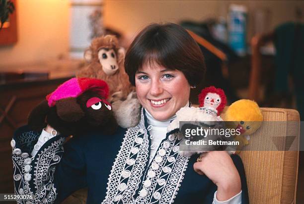 Dorothy Hamill, the top U.S. Figure skater, is surrounded by her dolls which she uses as good luck charms, during recent U.S. Figure Skating...