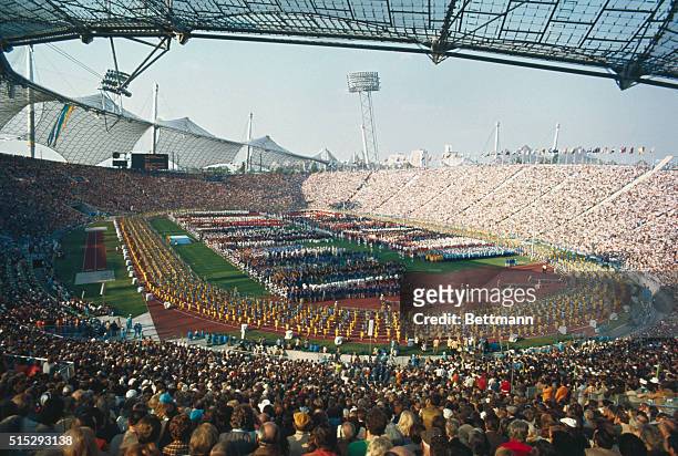 Munich, Germany. Olympic Stadium is packed with some 80,000 people as the finest amateur athletes in the world parade on the field below. Slide shows...