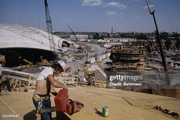 The site for the 1976 Olympics is still a clutter of cranes, rods and boards as workmen press ahead to finish construction by opening day 7/17/1976....