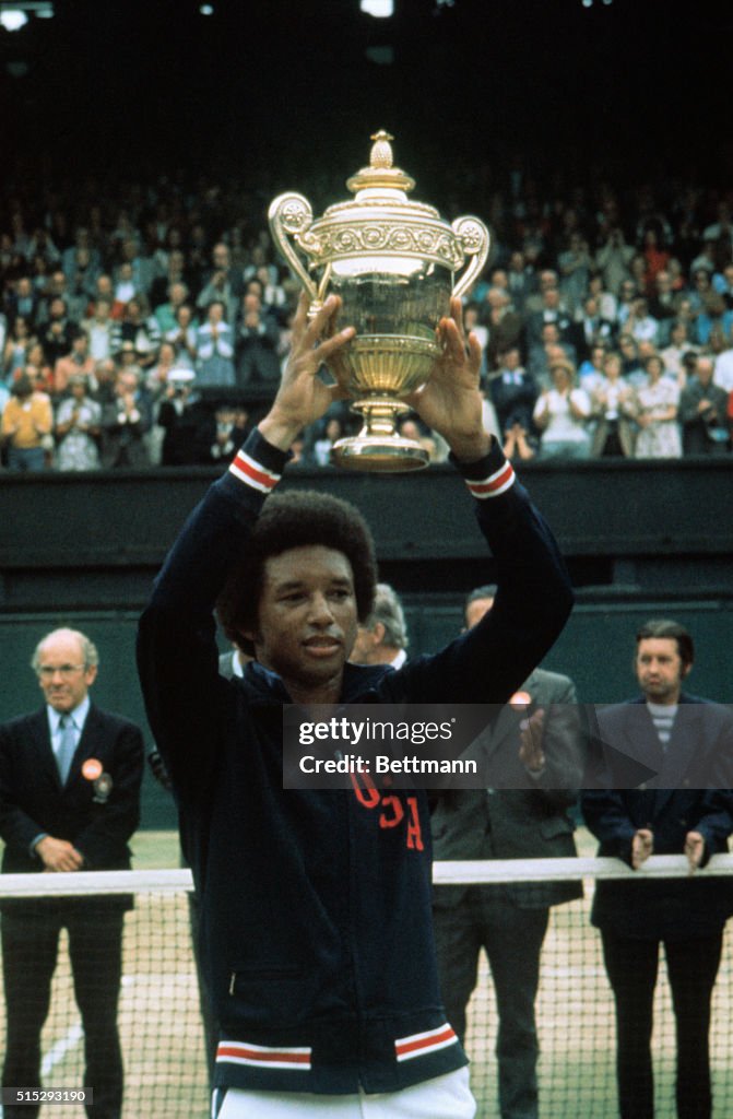 Arthur Ashe Holding Up Wimbledon Trophy