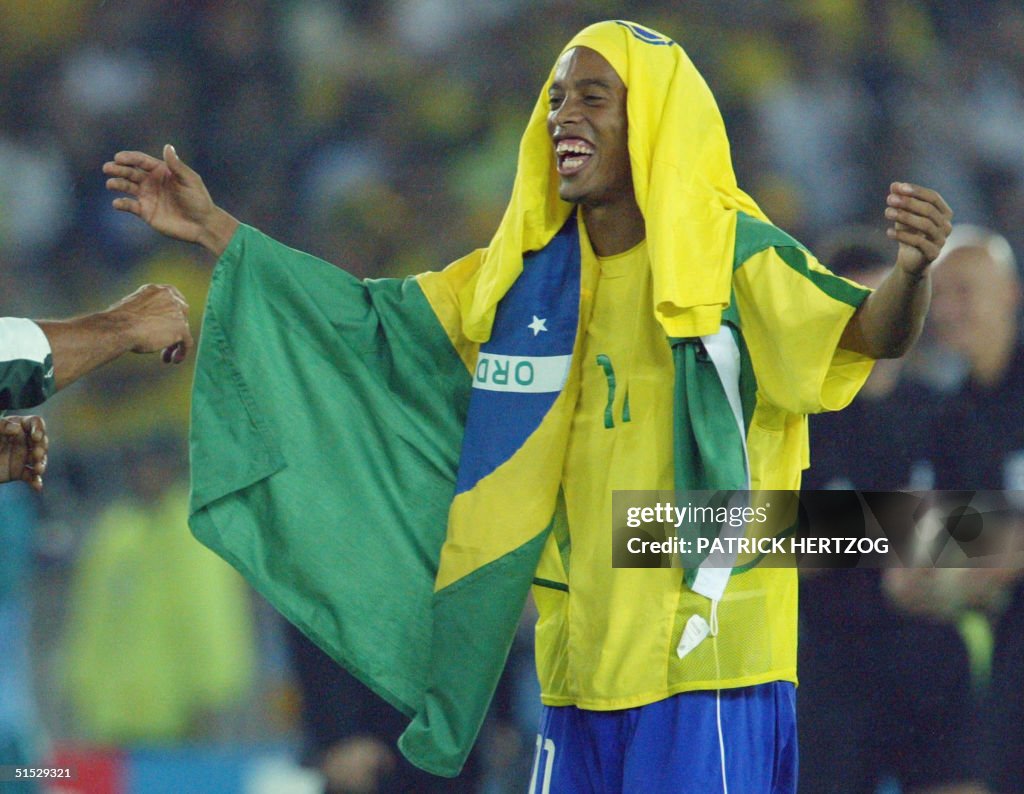 Brazilian midfielder Ronaldinho celebrates the vic