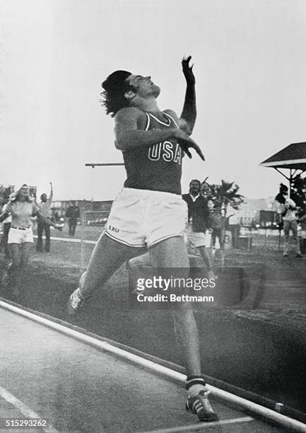 Eugene, Oregon: : Bruce Jenner, USA, San Jose Stars Track Club, throws his head back after crossing the finish line in 1500 meter run in decathlon...