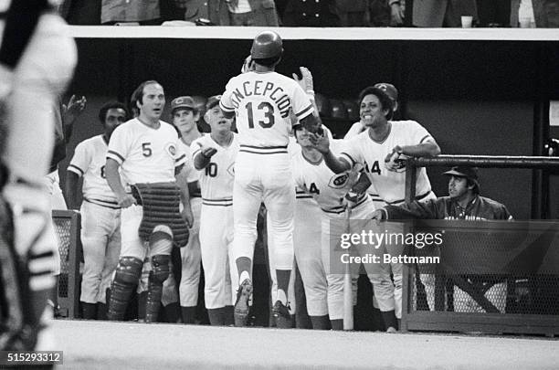 Cincinnati: Dave Concepcion is welcomed to Reds' dugout after hitting home run in game of the World Series. At left is Johnny Bench; at right is Tony...