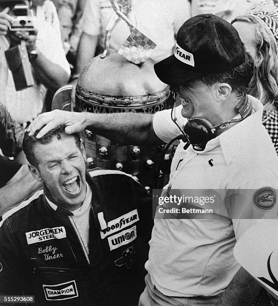 Indianapolis: A jubilant Bobby Unser gets a rewarding pat on the head from car owner Dan Gurney after Unser won his second Indianapolis 500 5/25. He...