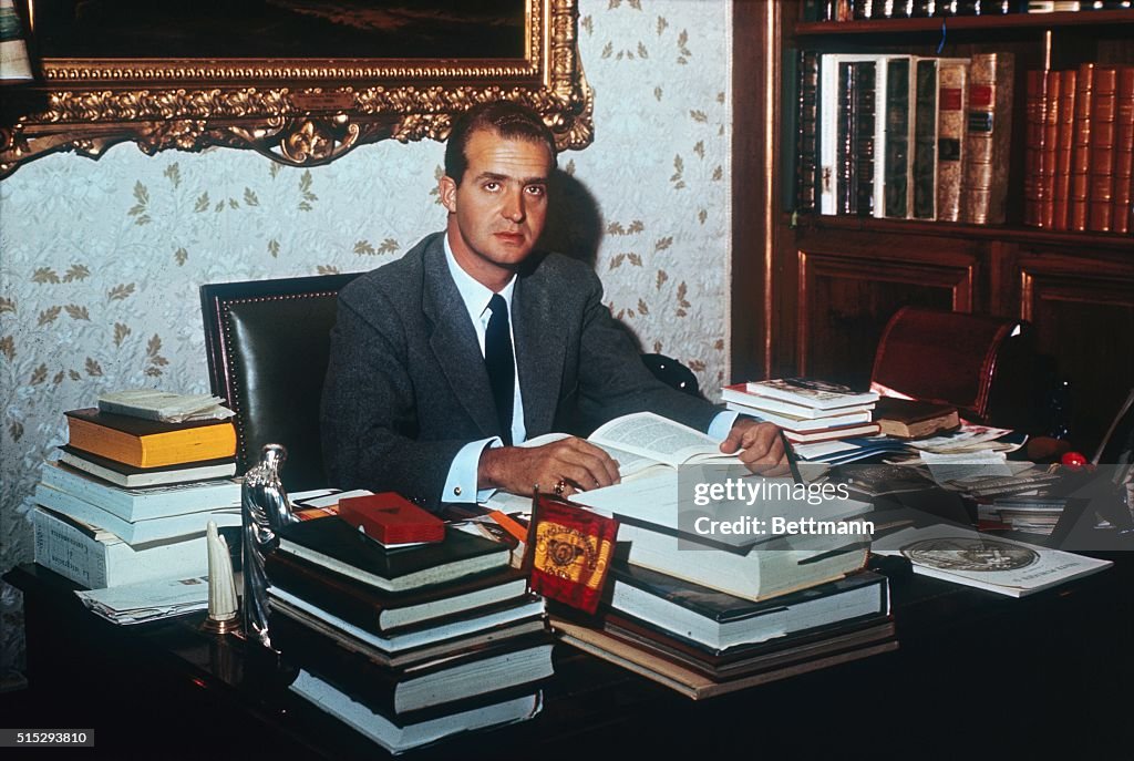 Prince Juan Carlos Reading at Desk