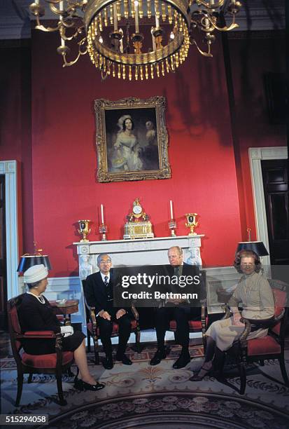 Washington, D. C.: President Gerald Ford and First Lady, Betty Ford, and their Japanese visitors, Emperor Hirohito and Empress Nagako, enjoy friendly...