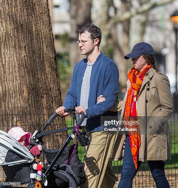 Chelsea Clinton and Marc Mezvinsky with daughter Charlotte Mezvinsky are seen on March 12, 2016 in New York City.