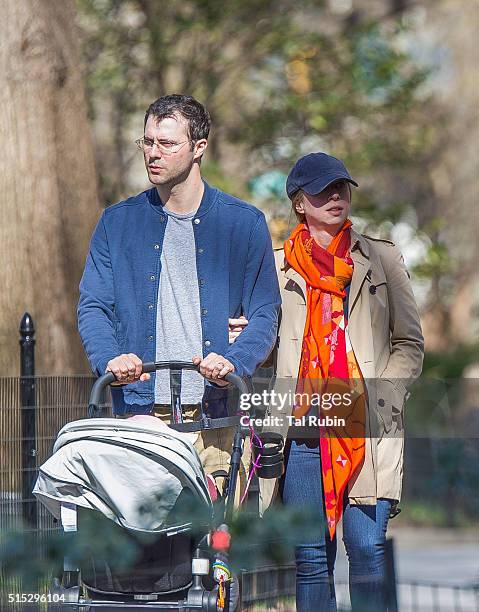 Chelsea Clinton and Marc Mezvinsky with daughter Charlotte Mezvinsky are seen on March 12, 2016 in New York City.