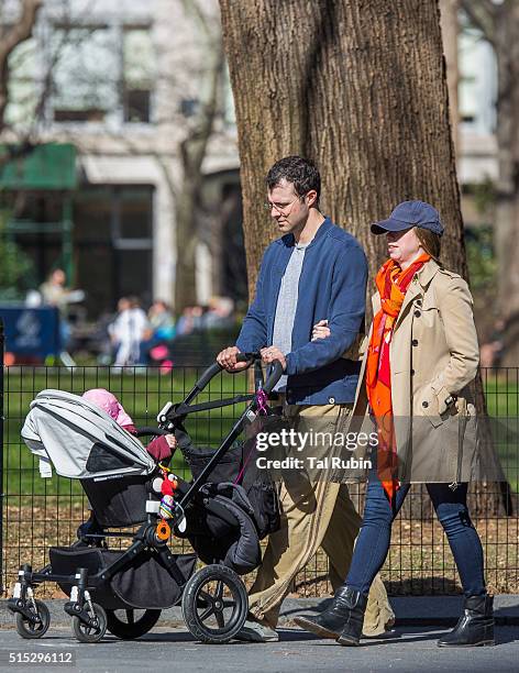 Chelsea Clinton and Marc Mezvinsky with daughter Charlotte Mezvinsky are seen on March 12, 2016 in New York City.