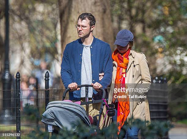Chelsea Clinton and Marc Mezvinsky with daughter Charlotte Mezvinsky are seen on March 12, 2016 in New York City.