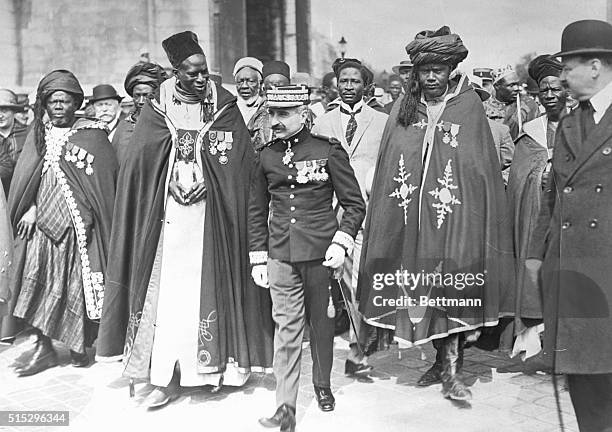 Native Black Chiefs in Paris. Paris, France: The delegation of 27 chieftains of French colonies in African are here shown under the escort of a...