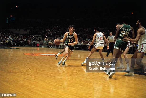 John Havlicek , basketball player for the Boston Celtics, in action against the New York Knicks. Slide shows Havlicek dribbling the ball down the...