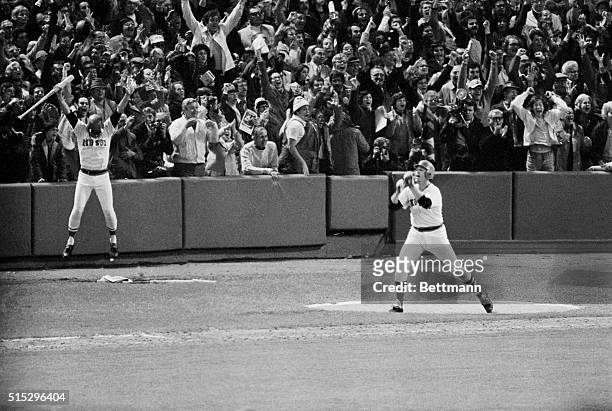 World Series-6th Game-Boston: Carlton Fisk of the Red Sox jumps with joy after hitting the game winning home run in the 12th inning. The Red Sox...