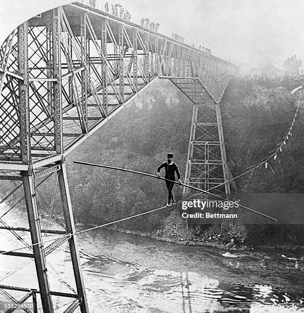 Samuel J. Dixon of Toronto walks across the Niagara River Gorge on a 7/8-inch rope above the Whirlpool Rapids on September 6, 1890. Dixon crossed...