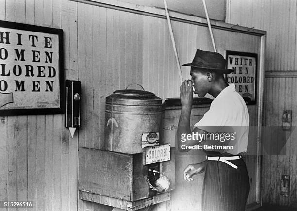 Jim Crowism: Drinking fountain for colored men in a streetcar terminal in Oklahoma City. Photograph, 1939. Original Caption
