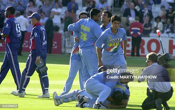 India's captain Sourav Ganguly jubilates on the ground and congratulates Mohammed Kaif who scored the winning runs, 13 July 2002 at Lord's in London...