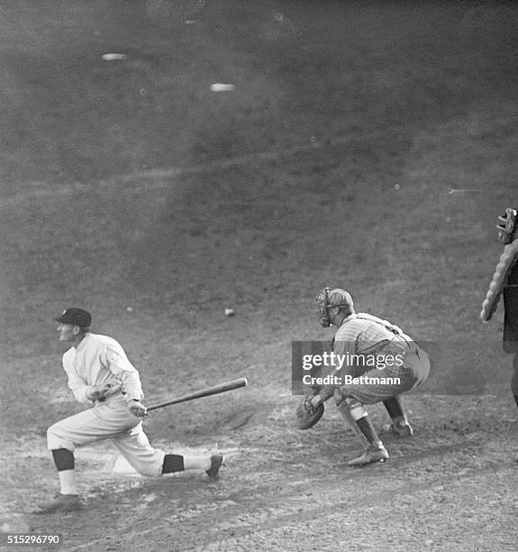 Pitcher Walter Johnson hits a long fly to left field in the seventh game of the World Series, a game that the Washington Senators won.