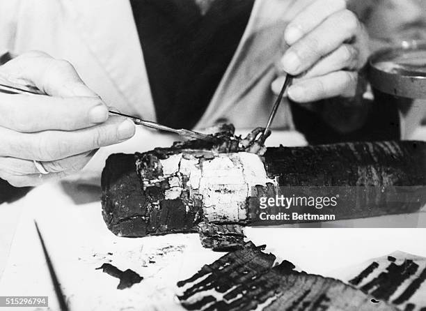 Dead Sea Scrolls: An intricate and delicate operation in process of restoring Dead Sea Scrolls, is performed by Professor Bieberharant, in 1955, at...