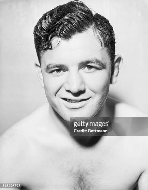 New York, NY- A world of confidence is expressed in the smile of Jimmy Braddock at Stillman's Gymnasium in New York, where he is rounding out...