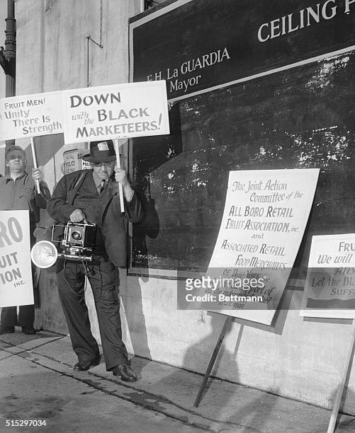 New York, NY- Down at the Bronx Terminal Market, at 151st and Exterior Streets, to cover the picketing by retail dealers, photographer "Weegee" got...
