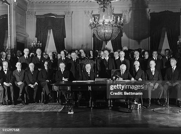 Washington, D.C.- Photograph taken in the East Room of the White House when President Coolidge and Secretary of State Kellogg signed the Kellogg...