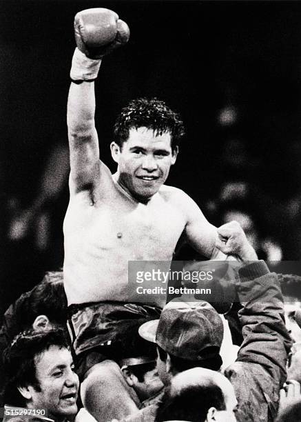 Las Vegas, Nevada-: Julio Cesar Chavez of Mexico raises his arm in jubilation after defeating WBA lightweight champion Edwin Rosario of Puerto Rico...